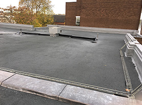 Liquid Rubber waterproofing system with a grey granite finish on a residential block in Camden with a 15 year warranty
